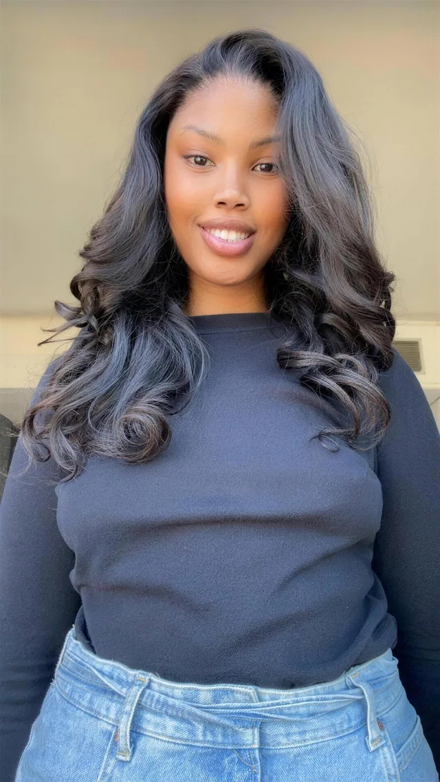 Naledi Mogomane, designer of JOZI — WAH GWAAN, smiling in a dark top